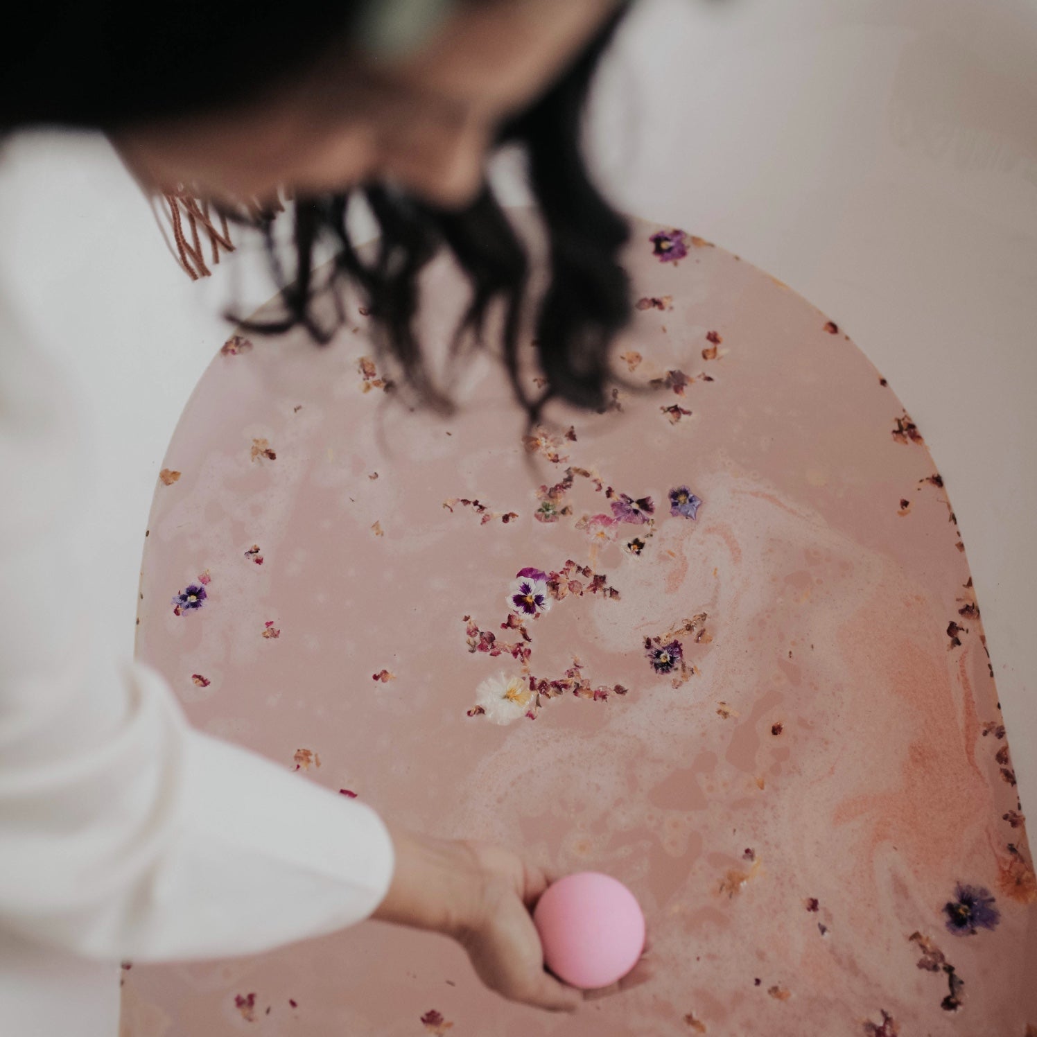 at home spa experience: bath bomb in the tub