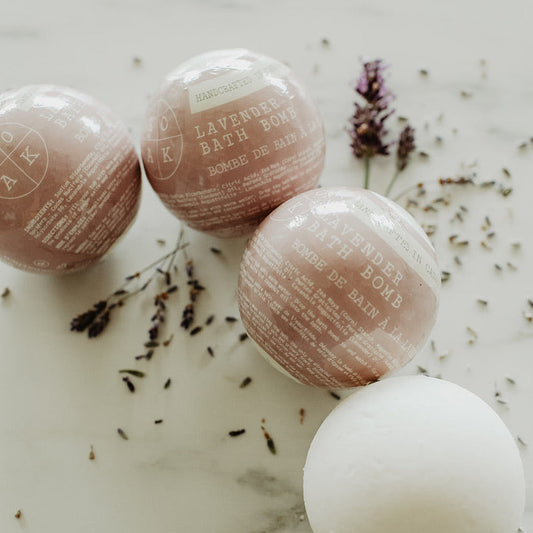 Bath bombs with lavender on a marble surface