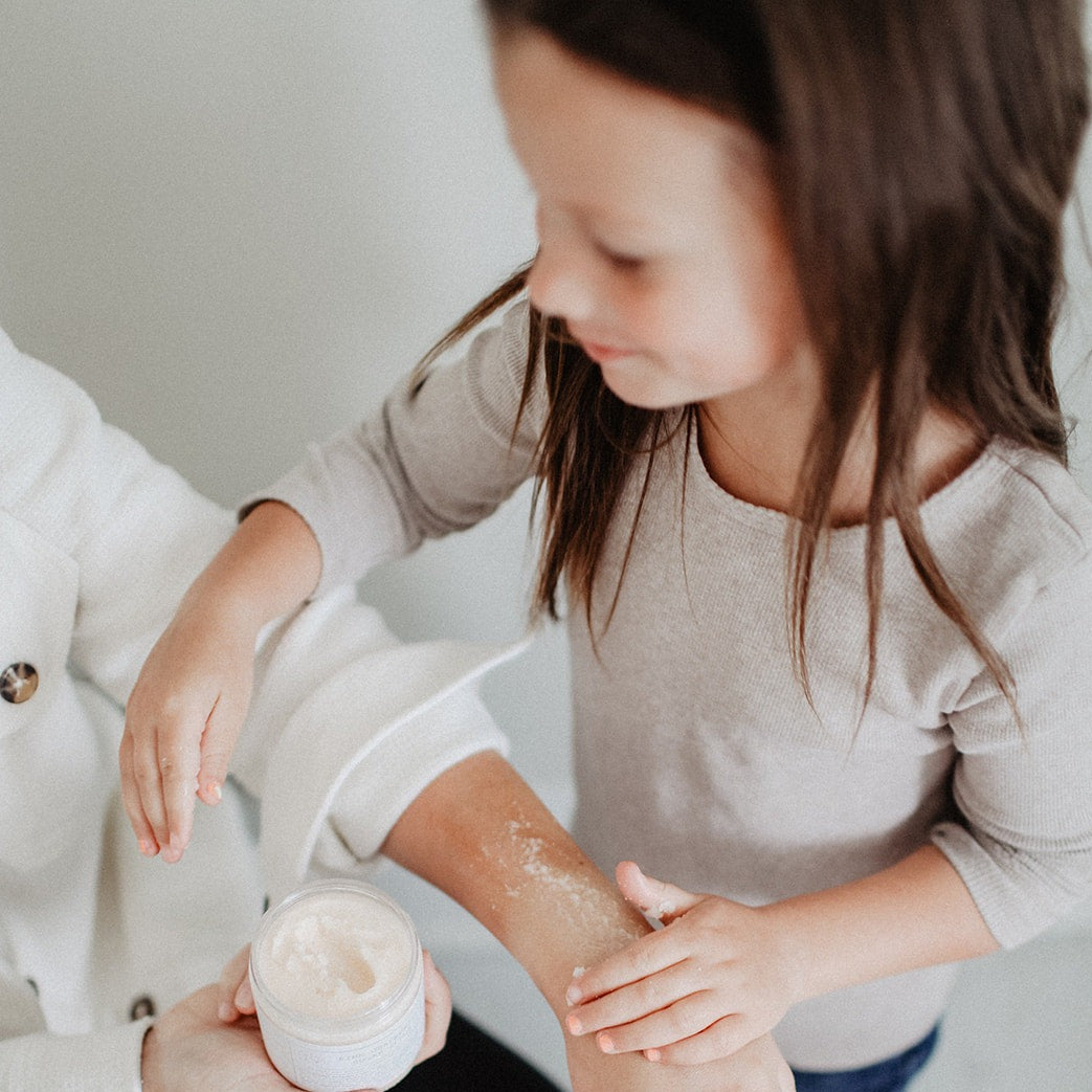 Pink Grapefruit Sugar Scrub being used by a mother and daughter