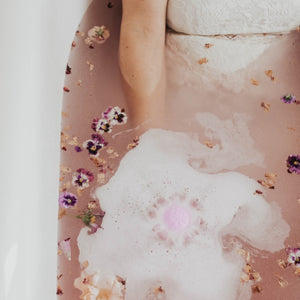 SOAK Bath Co bath bomb in the tub for self care